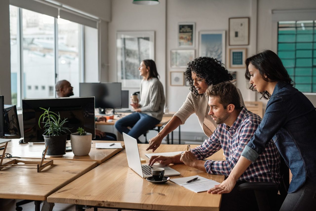 REVOL agents producing marketing content together in the office